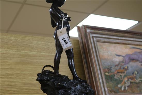 A bronze of a fisherboy, signed, on marble base